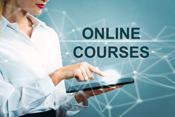 woman using computer to log into online courses